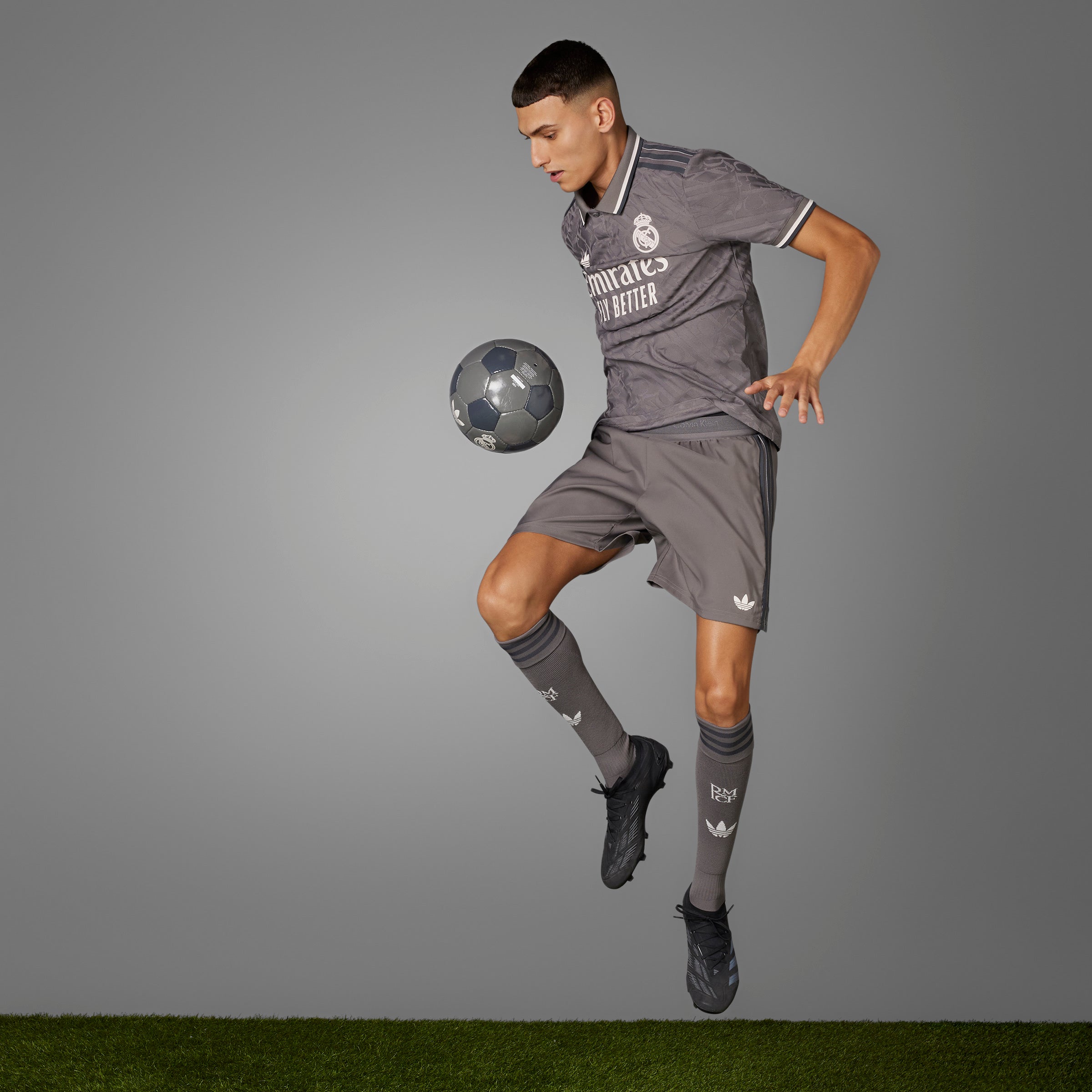 Real Madrid Authentic Third Jersey on Model jumping with ball close to knee